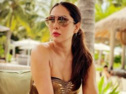 Check out! Kim Sharma looks drop-dead gorgeous in a golden monokini
