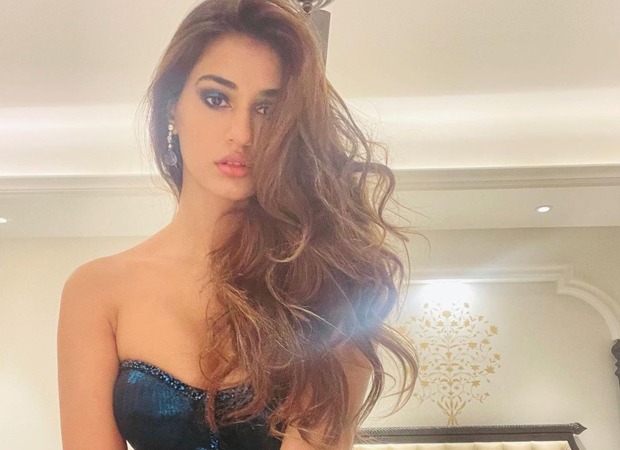 Disha Patani looks like a sultry beauty dressed in a bodycon dress with a thigh-high slit