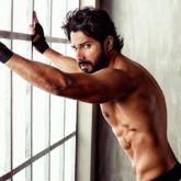 HAWT! Varun Dhawan flaunts his chiseled abs with an intense expression as he poses shirtless