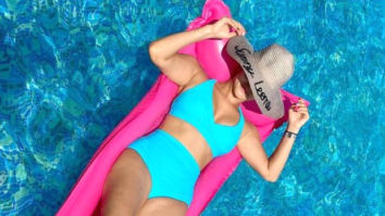 Sunny Leone flaunts her bikini body in an aqua blue swimsuit as she chills in the pool