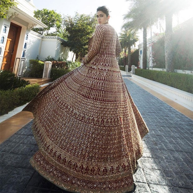 Sara Ali Khan unearths gliding and glorious affair in red and gold lehenga from Manish Malhotra's Nooraniyat collection