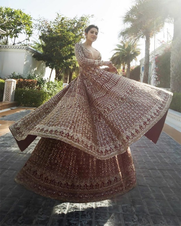 Sara Ali Khan unearths gliding and glorious affair in red and gold lehenga from Manish Malhotra's Nooraniyat collection
