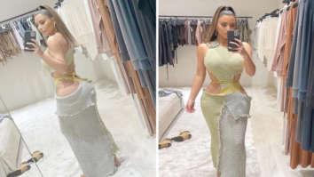 Kim Kardashian’s unusual cut-out vacation dress is gaining a lot of attention