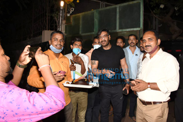 Photos: Ajay Devgn snapped cutting a birthday cake with fans Photos: Ajay Devgn snapped cutting a birthday cake with fans
