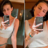 Mandana Karimi shares a video flaunting her curves in a bikini bottom and white crop-top