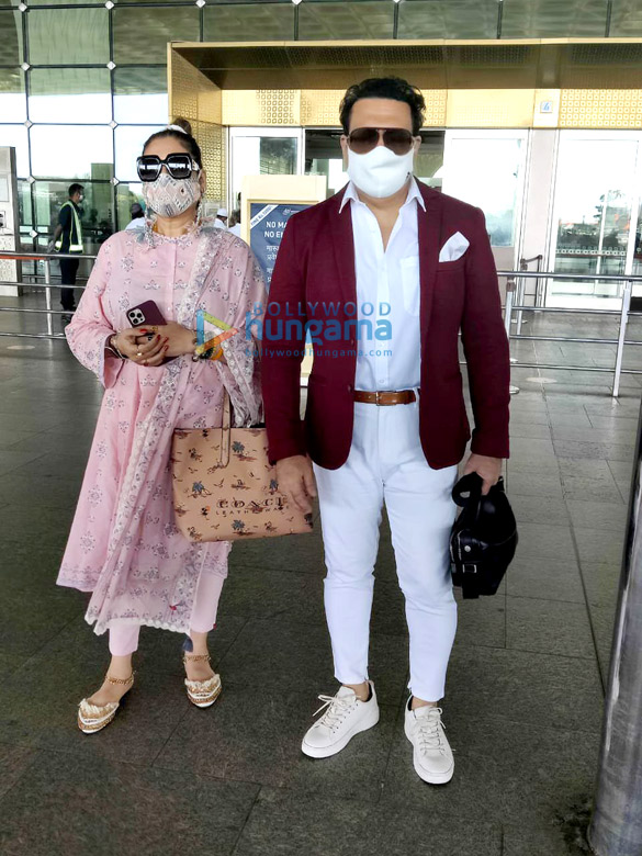 photos govinda and wife sunita ahuja snapped at the airport 1 2