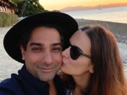 Evelyn Sharma gives a sweet kiss to her husband Tushaan Bhindi whilst on their honeymoon