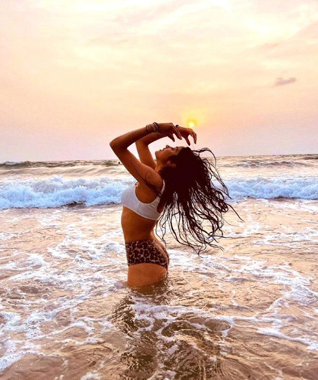 Janhvi Kapoor gives major beach goals in white top and animal print bikini bottom in picturesque sunset photos 