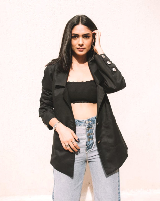 Mrunal Thakur pairs a black bralette with a blazer and flared jeans for Toofan promotions