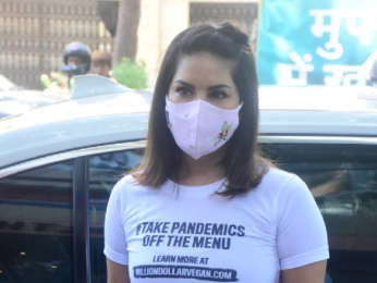 Sunny Leone and Daniel Weber snapped distributing food at Earth cafe in Bandra