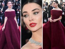 Amy Jackson makes opulent red carpet appearance at Cannes 2021 in long-trail burgundy off-shoulder gown