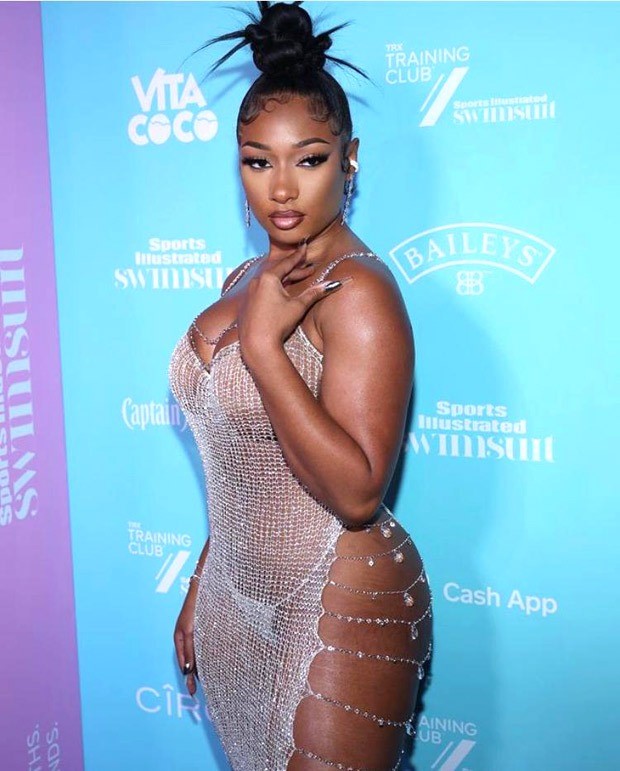 Megan Thee Stallion sets the internet ablaze in sheer crystal chain dress with waist-high slit for Sports Illustrated swimsuit launch