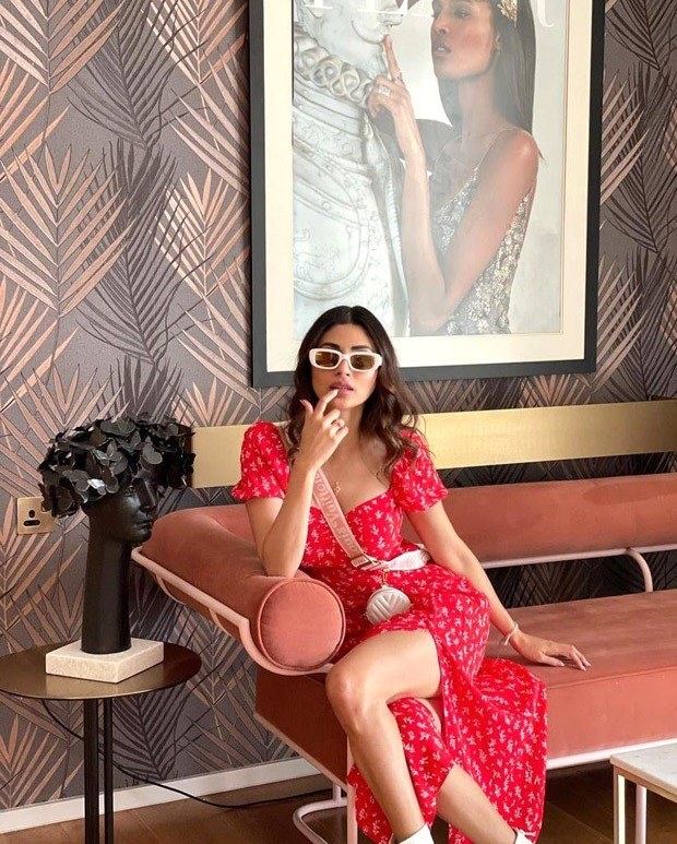 Mouni Roy pairs a red thigh-high slit midi dress with Louis Vuitton mini cross body bag worth Rs. 2.37 lakh Mouni Roy pairs a red thigh-high slit midi dress with Louis Vuitton mini cross body bag worth Rs. 2.37 lakh