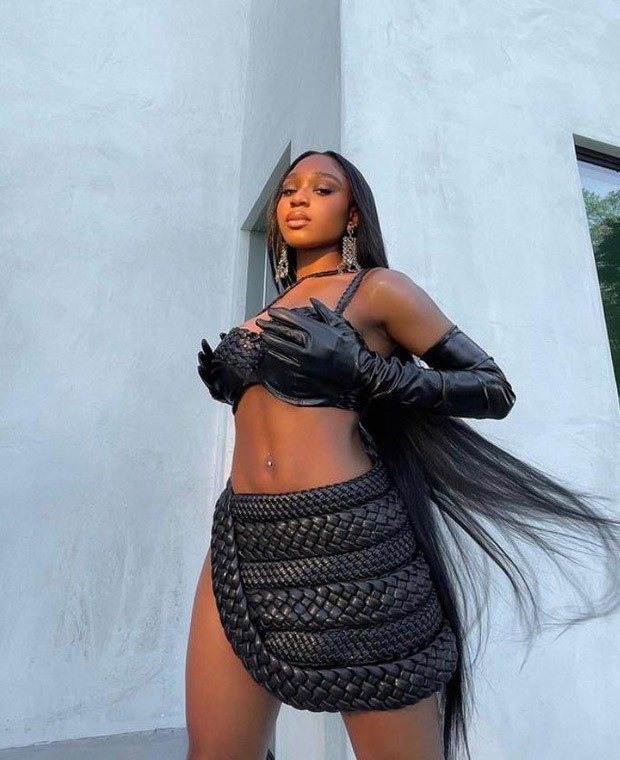 Normani shows her 'Wild Side' in sultry braided leather bralette and mini skirt with waist-high slit