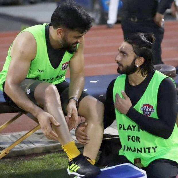 Ranveer Singh and M.S Dhoni share a victory hug during their football match