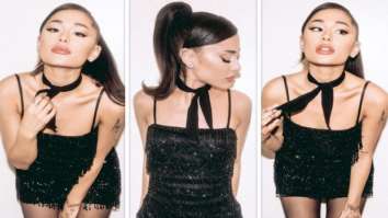 Ariana Grande stuns in a mini black dress with glitter details, stockings and signature high pony tail