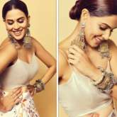 Genelia Deshmukh makes a statement in a specially printed skirt and cowl neck satin top
