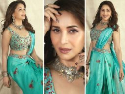Madhuri Dixit looks gorgeous in a Turquoise pre-draped saree from Punit Balana worth Rs.35,500