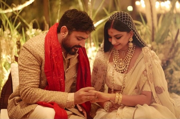 Rhea Kapoor shares her first wedding picture with her husband Karan Boolani donning ivory Anamika Khanna lehenga 