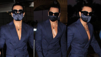 Ranveer Singh oozes charm in a crisp blue suit as he is spotted at the airport flaunting his sculpted abs
