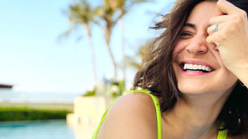 Anushka Sharma lights up as she poses in the pool in a neon green monokini