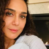 New mom Preity Zinta cuddles one of her twins in first picture of her newborn