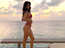 Disha Patani strikes a sensuous pose in a skimpy red bikini
