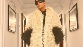 Karan Johar strikes a pose in a Gucci outfit paired with red boots; Farah Khan calls it Ostrich outfit, netizens agree