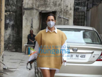 Photos: Malaika Arora pairs full sleeve shirt and beige sweater and mini shorts as she gets snapped outside a clinic in Santacruz
