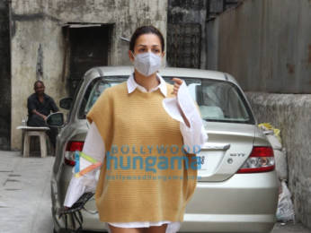 Photos: Malaika Arora pairs full sleeve shirt and beige sweater and mini shorts as she gets snapped outside a clinic in Santacruz