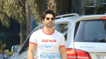 Photos: Varun Dhawan spotted in a white T-shirt and blue denim pants at Sajid Nadiadwala’s office in Andheri