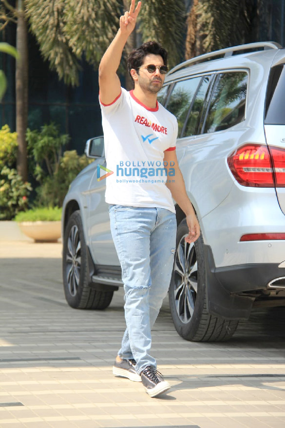 photos varun dhawan spotted in a white t shirt and blue denim pants at sajid nadiadwalas office in andheri 3