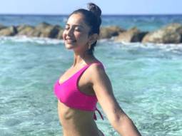 Rakul Preet Singh shows off her toned beach body in a bright pink bikini in Maldives