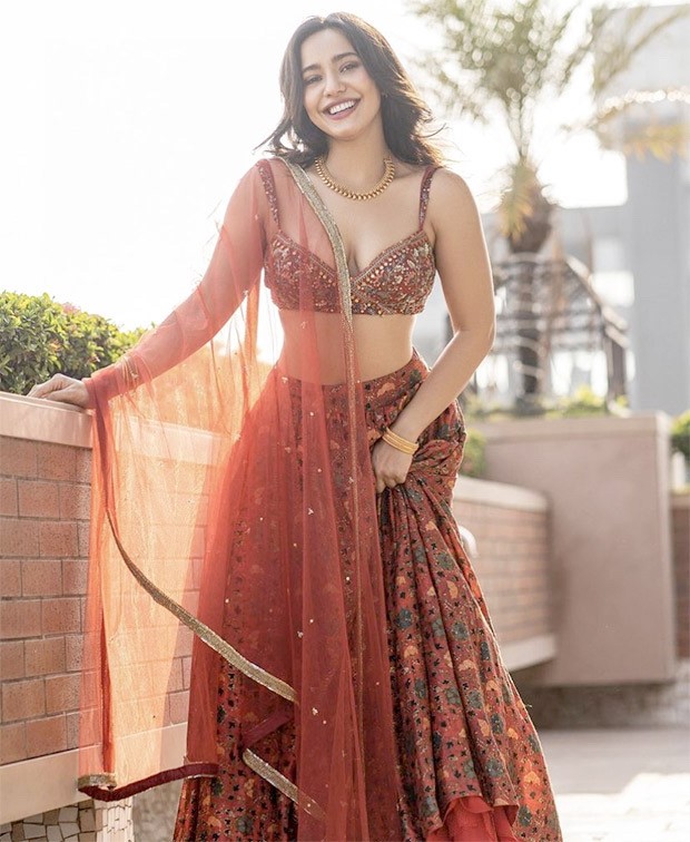 Neha Sharma's contemporary cherry red floral printed lehenga set worth Rs. 39,200 is perfect for spring weddings