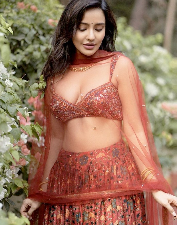 Neha Sharma's contemporary cherry red floral printed lehenga set worth Rs. 39,200 is perfect for spring weddings