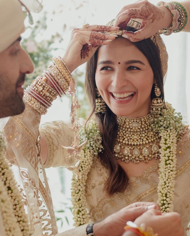 Ranbir Kapoor-Alia Bhatt Wedding: Bride wore hand dyed ivory organza embroidered saree; groom donned embroidered silk sherwani with uncut diamonds by Sabysachi Mukherjee 