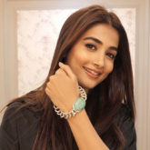 Pooja Hegde poses on the sets of Kabhi Eid Kabhi Diwali wearing a bracelet similar to that of co-star Salman Khan