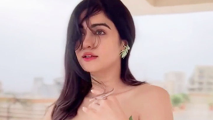 Adah Sharma poses with a lizard wearing a leafy dress