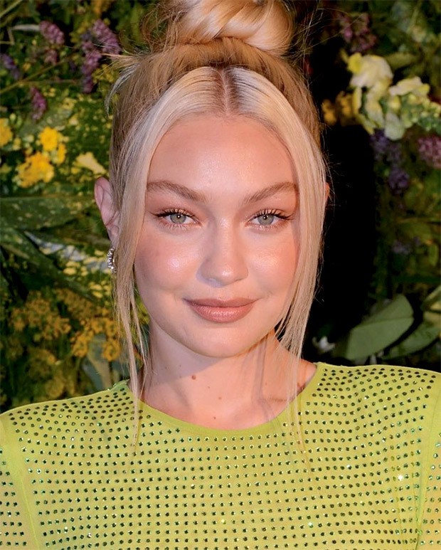 Gigi Hadid amps up the glam in a green body-con dress for British Vogue X  Self Portrait's Summer Party in London