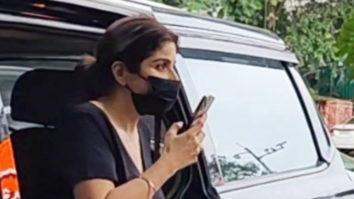 Maheep Kapoor waves her hand as she poses for paps