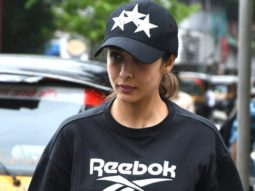 Malaika Arora poses to paparazzi as she returns home