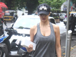 Malaika Arora smiles as she poses for paps