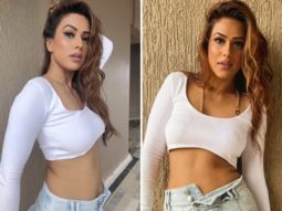 Nia Sharma poses on balcony in a micro-mini denim skirt and a crop top