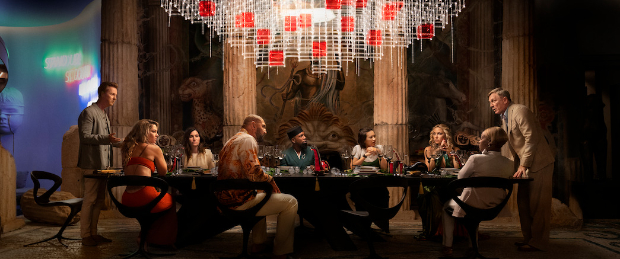 Glass Onion - A Knives Out Mystery First Look: Daniel Craig, Edward Norton, Janelle Monáe, Kathryn Hahn among others sit at the dinner table in Rian Johnson's mystery sequel