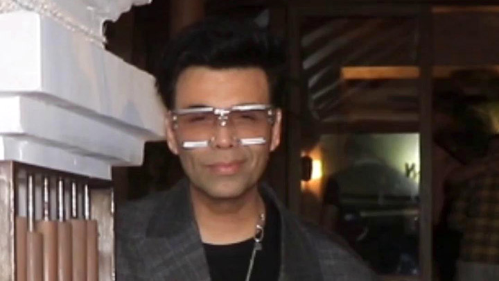 Karan Johar snapped in an oversized coat and funky glasses