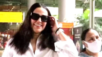 Neha Dhupia snapped at the airport in white shirt and denims