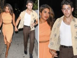 Priyanka Chopra in a salmon crop top and skirt and Nick Jonas in a tank top and an unbuttoned shirt spotted holding hands post dinner date