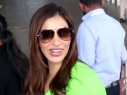 Sophie Choudry smiles for the paps as she gets snapped at the airport