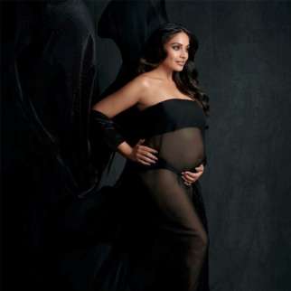 Bipasha Basu cradles bare baby bump in a sheer black gown; shares stunning images from her maternity shoot