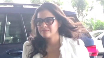 Kajol greets paps outside the airport